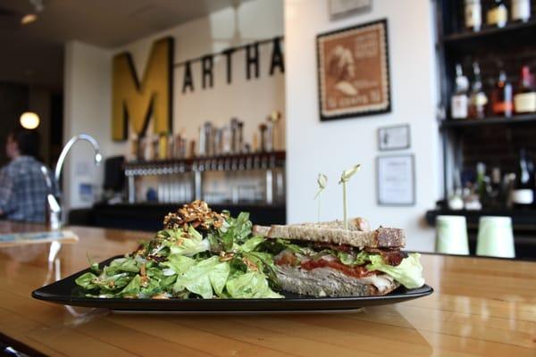 The King's Around:  Free range smoked turkey, peppered bacon, roasted tomato, pickled onion, greens, stone ground mustard and mayo on rye.