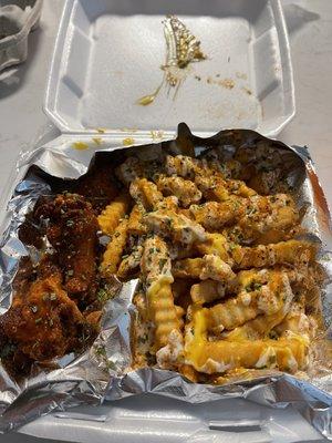 Hot Lemon Pepper wings and ranch, cheese and cajun fries