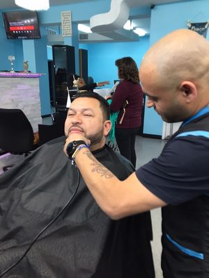 Men's haircut and beard includes exfoliate, hot and cool towel shave w/ razor