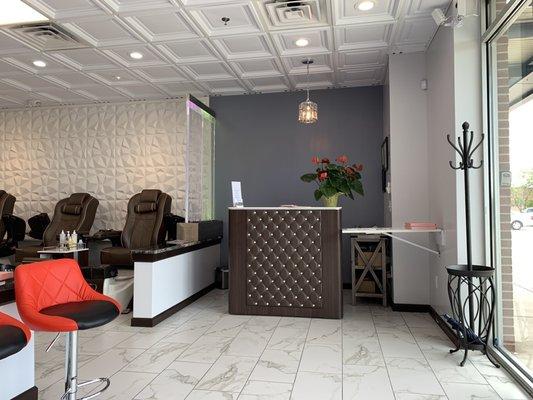 Reception desk and some of the pedicure massage chairs.