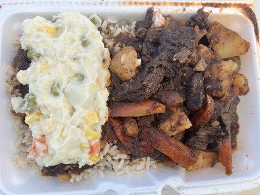 Potato salad, pepper steak and rice and beans