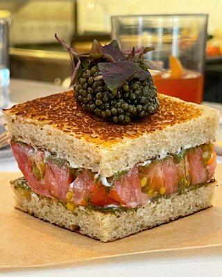 Heirloom tomato sandwich with smoked mayo, gamtae & golden Ossetra caviar