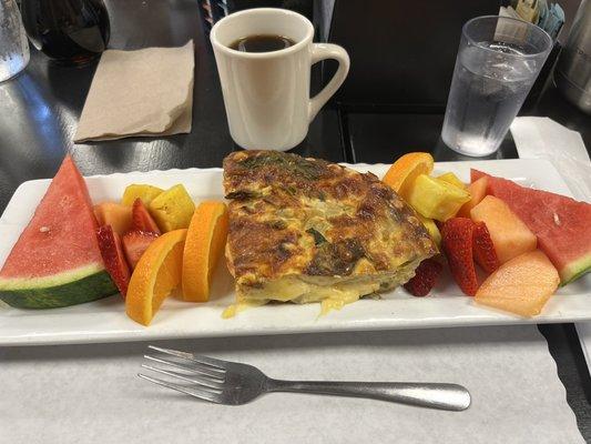 Vegetable quiche with a side of seasonal fruit