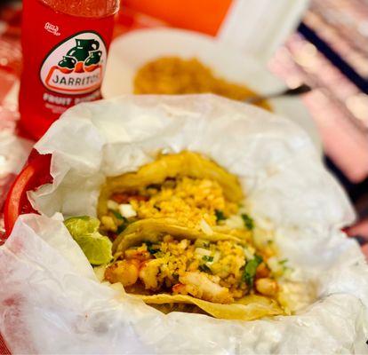 Shrimp tacos with fruit punch Jarritos