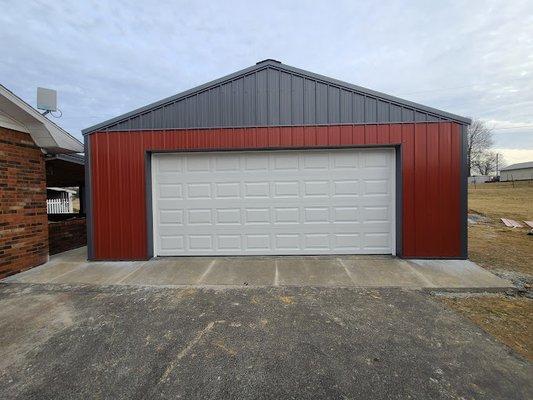 This white garage door was the cherry on top for this gorgeous detached garage door!