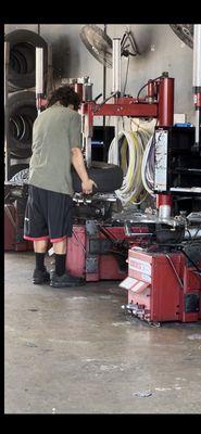 Mounting new trailer tire. He did not balance my tire.