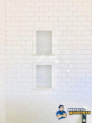 Niches: perfect combination of white subway tile, mosaic and marble installed by Perfecto Handyman.