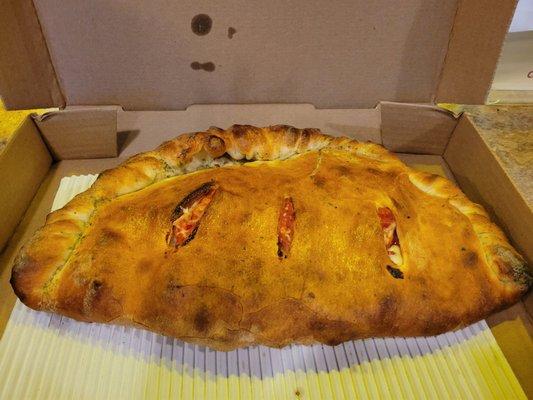 Large Manhattan calzone. I swear that they used to be bigger. Not cheap at $27. No sauce included?