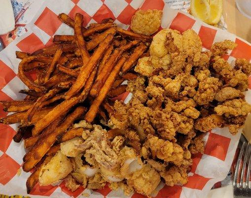 Fried seafood platter with sweet potato fries