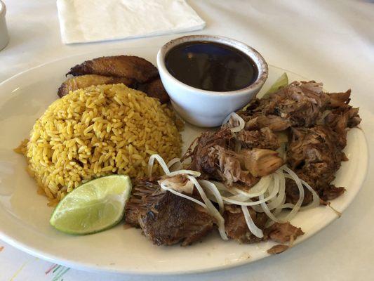 Roast pork with black beans, yellow rice, and sweet plantains