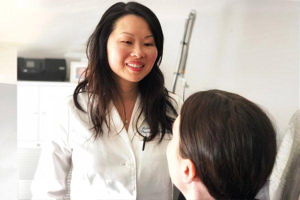 Anne while consulting with a patient.