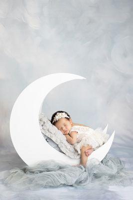 San Diego area newborn photographer, based in Carlsbad.  Baby in a moon prop.