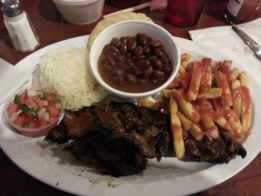 Rice, beans , fries and carne asada.