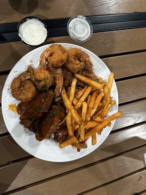 this is their fried shrimp and wing platter. the sauce on the wings was spicy garlic. i also ordered grilled oysters