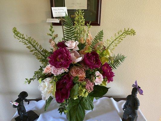 Peonies, roses, ferns and many other leaves and flowers.