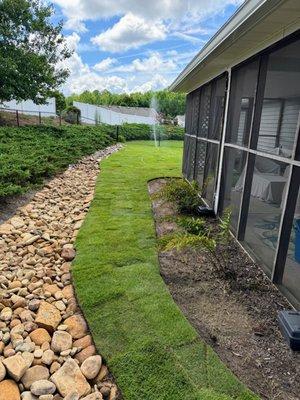 dry creek bed and sod installation.