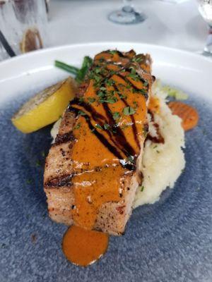 Grilled salmon over garlic mashed potatoes