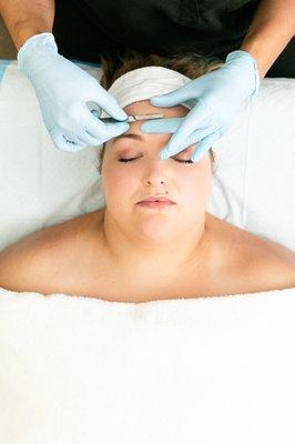 Gently exfoliate and remove peach fuzz with dermaplaning.