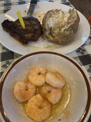 Steak, shrimp and baked potato.