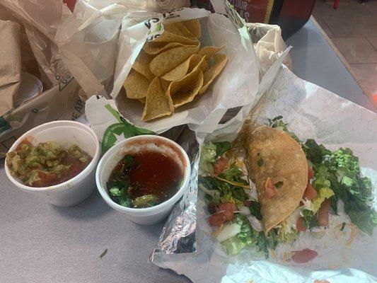 Ground beef crispy taco w/generous fresh toppings, guacamole, salsa & chips. Very good! Great house-made crispy taco shell/chips