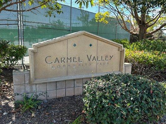 We are part of the Carmel Valley Community park.  Located at the top of Townsgate Drive and Pell Place, right across from Jimbos.