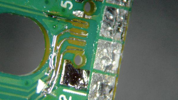 Micro soldering repair. Torn off contacts mid-repair