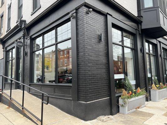 Corner storefront with accessibility for those handicapped and/or disabled.