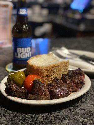 Steak kabobs with peppers and bread.  Absolutely delicious.