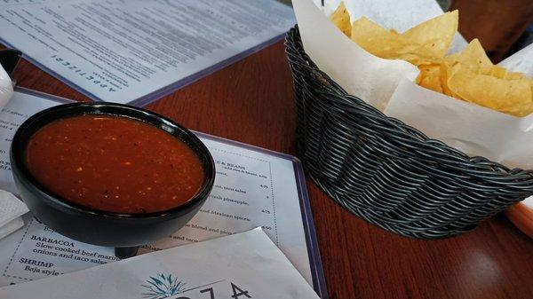 The perfect welcome - salsa, chips, and a drink menu