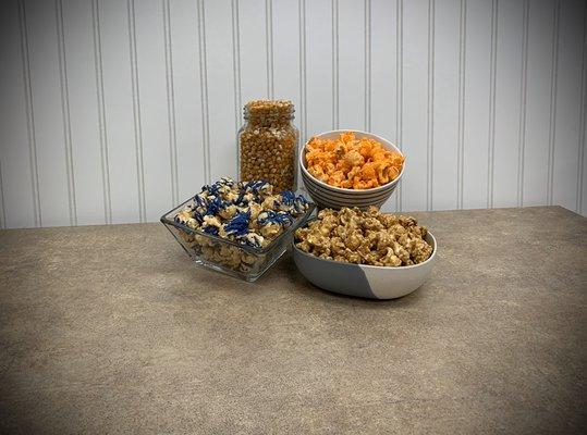 Our Signature Caramel, Huckleberry Cheesecake and Cheddar Cheese Gourmet Popcorn.