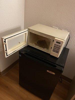 Nasty dirty fridge and microwave that I paid extra to have in my room.