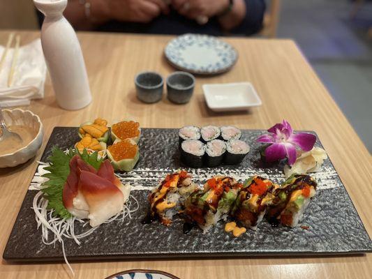 Red clam, uni and Ikura sashimi. Yellowtail and scallion roll. Dynamite Roll with lobster