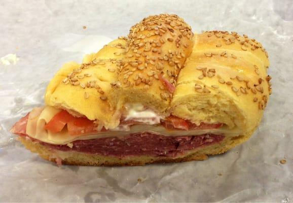 Salami & Swiss on a seeded gutted roll w/ tomato, mayo & vinegar