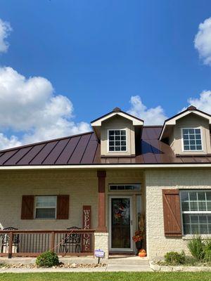 This custom brown metal roof enhances this already beautiful home! Call Wilson Roofing and Renovations today for your free consultation!