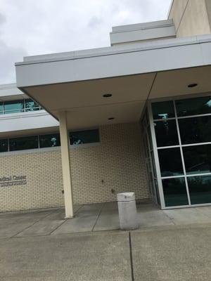 Side door to enter on weekends because the doors facing the library are locked.