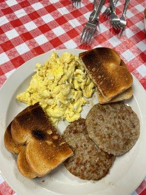 Scrabble eggs and sausage patty. With toast