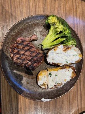 Lunch steak, loaded potato skins, and very crispy broccoli