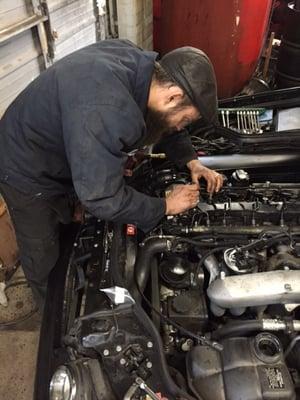 Andrew working on a car