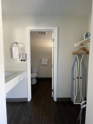 Bathroom with a tub, sink and closet separate