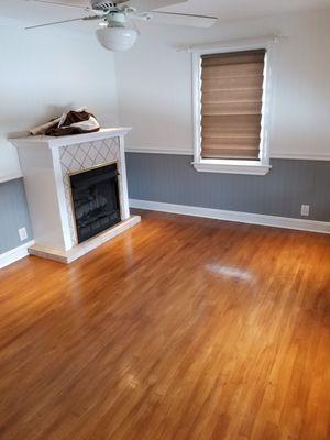 Living room  / Freshly painted walls, trim, ceiling and varnished floor.