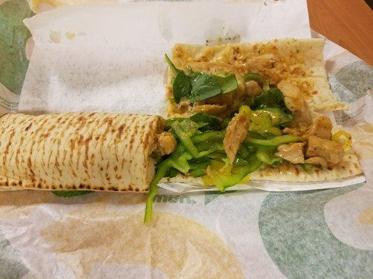 sweet onion chicken teriyaki on a flatbread, with spinach, green peppers, and banana peppers.