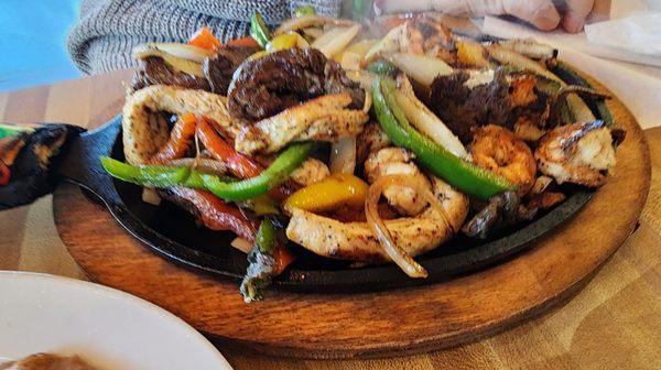 Jessy's Fajitas: shrimp, chicken & beef fajitas mixed with bell peppers & onions