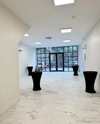 This beautiful space has an enormous amount of natural light due to our grand floor to wall glass doors .