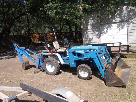 1215 ford backhoe with mower. I am installing a new control valve on the backhoe and it might be a few weeks before I get it finished.