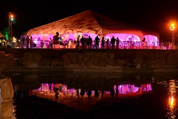 Night time view of the Grand Marque with reflection from our pond