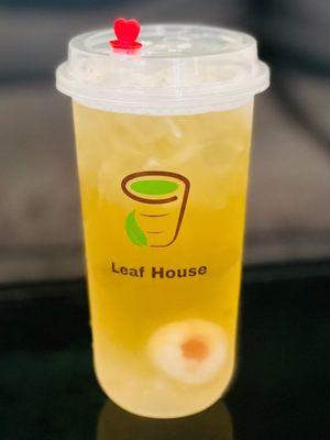 Green lychee tea with popping boba.