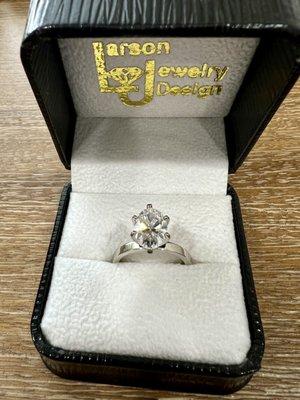 Engagement ring presented in Larson Jewlery Design case