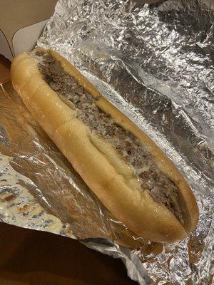 Delicious cheesesteak with fried onions.