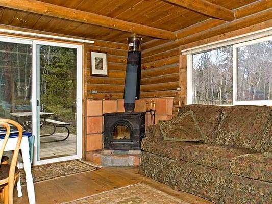 Cozy Honeymoon Hideout has woodstove.