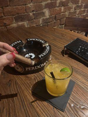 My spicy jalapeño margarita and sweet tipped cigar